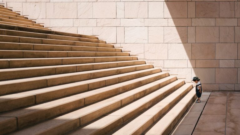 Lot of stairs with someone in front of it